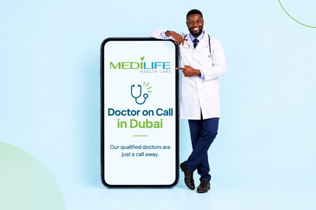 Doctor on call in Dubai pointing to a phone screen for booking a home visit online