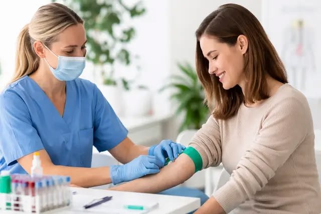Doctor collecting blood sample for home lab test in Dubai